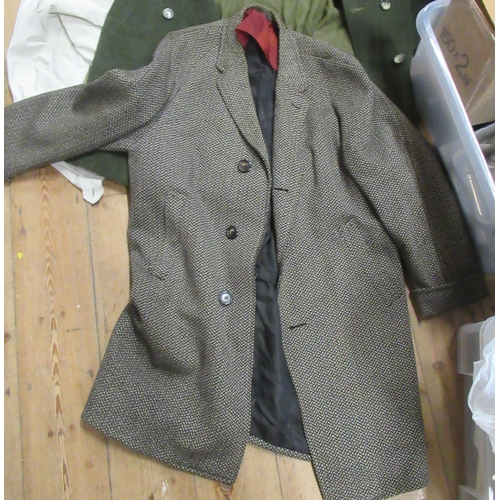 392 - A collection of clothing, to include suit, green long coat, jacket etc