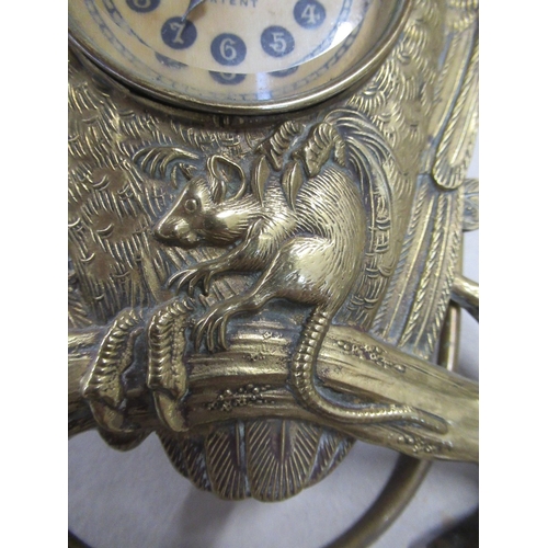 132 - British United Clock Co. Ltd, a brass mantel clock modelled as an owl with mouse in its claws, on a ... 