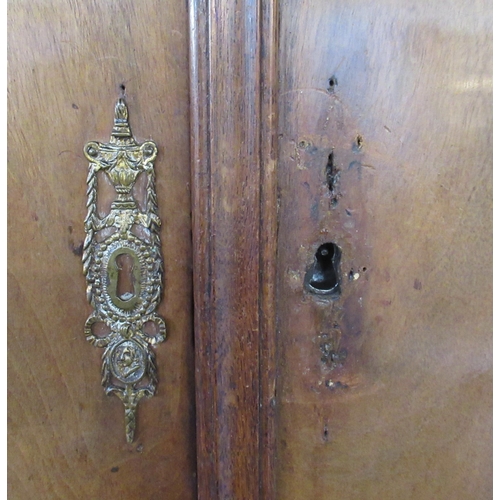 1 - A 19th century Dutch armoire,  the upper section having two drawers opening to reveal  shelves over ... 