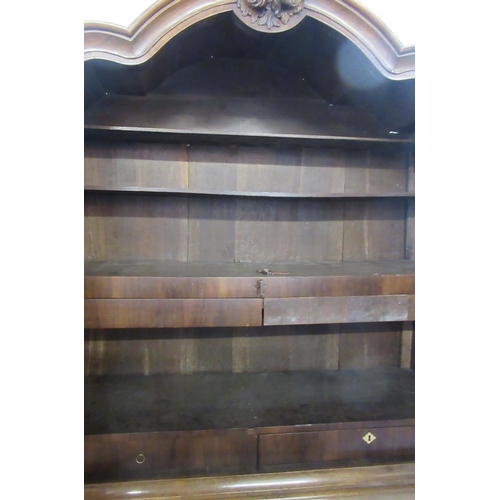 1 - A 19th century Dutch armoire,  the upper section having two drawers opening to reveal  shelves over ... 