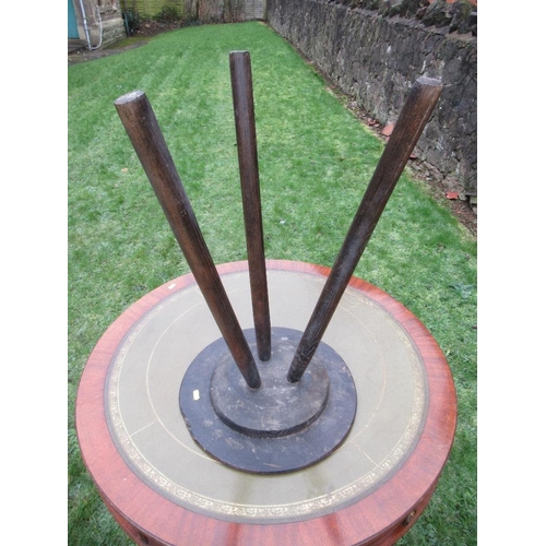 11 - A primitive style cricket table, raised on three slender legs diameter 16ins, height 27ins