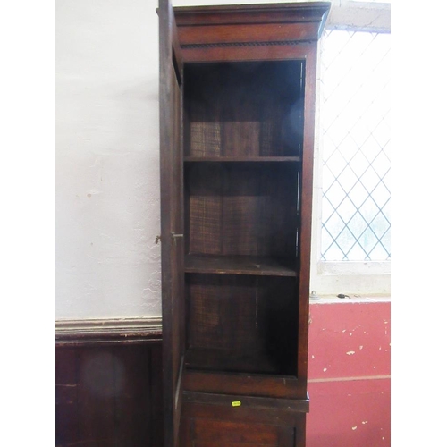 16 - An antique narrow cupboard having two fitted sections with fielded doors,  width 18ins, height 87ins