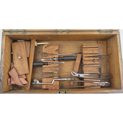 162 - An Early 20th Century/ World War Field Surgeon’s Set, in oak brass bound case, with interior tray an... 