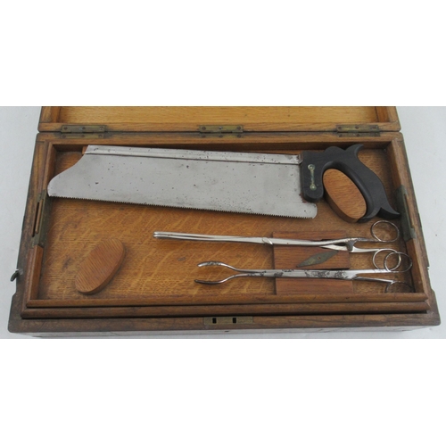 162 - An Early 20th Century/ World War Field Surgeon’s Set, in oak brass bound case, with interior tray an... 