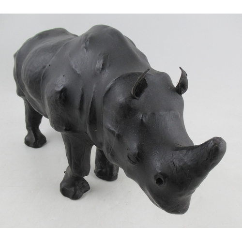 179 - A leather model of a rhinoceros, in the Liberty style, length 19ins,