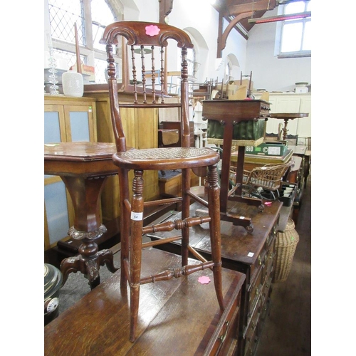 18 - WITHDRAWN A child's 19th century correction chair with turned spindle back to a canned seat