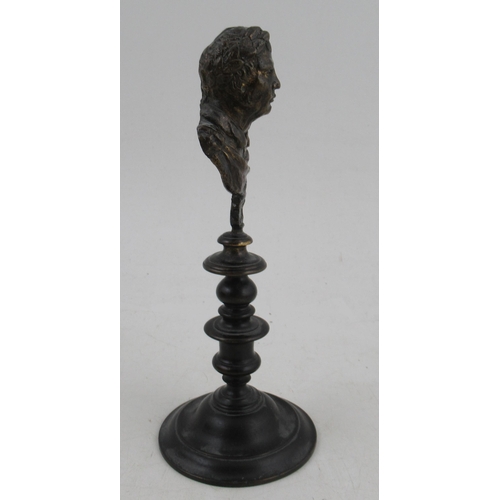 188 - An Antique bust, of neo classical figure, raised on a turned bronze pedestal, height 7.5ins