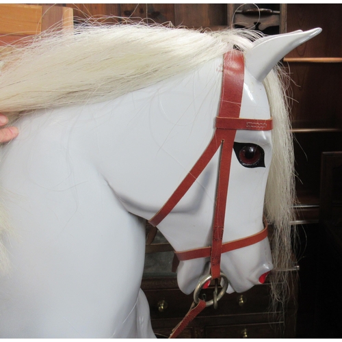 20 - A Carrington large dappled grey rocking horse, carved by Katherine M Stansfield width 70ins, height ... 