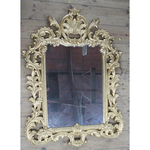 21 - A rectangular wall mirror, within an ornate pierced and scrolling acanthus gilt frame, mirror size 2... 