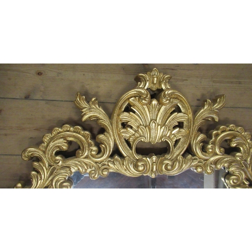 21 - A rectangular wall mirror, within an ornate pierced and scrolling acanthus gilt frame, mirror size 2... 