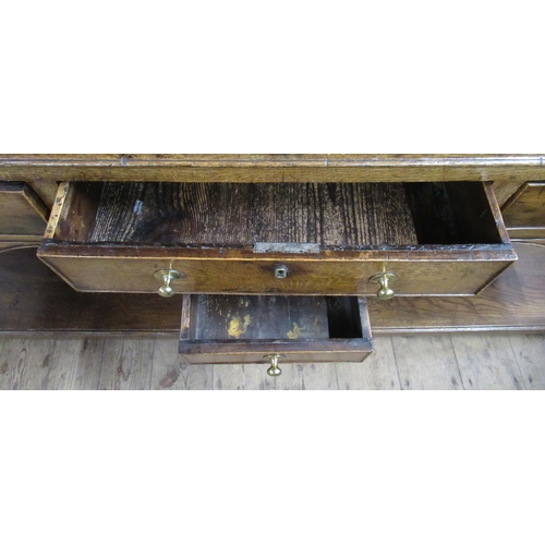 22 - An Antique oak dresser, the upper section fitted with shelves, the base fitted with six drawers, wit... 