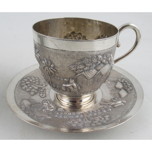 220 - A collection of Indian white metal, to include a cup and saucer, a vase, a dish, a shot cup and a na... 