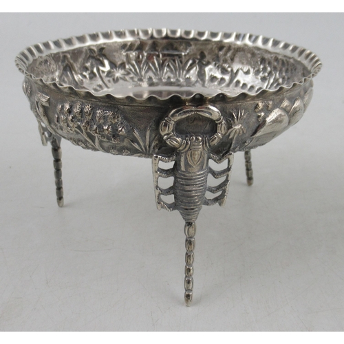 220 - A collection of Indian white metal, to include a cup and saucer, a vase, a dish, a shot cup and a na... 