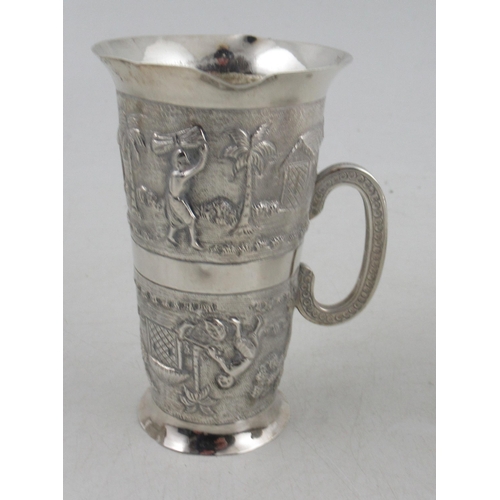 220 - A collection of Indian white metal, to include a cup and saucer, a vase, a dish, a shot cup and a na... 