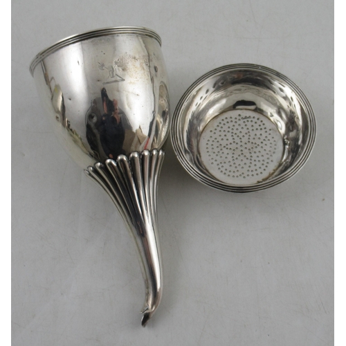 223 - A Georgian silver two piece wine funnel, having ribbed decoration and engraved crest, weight 5oz