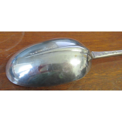 229 - An early 18th century silver serving spoon, with rat tail to the bowl, the knopped handle terminatin... 