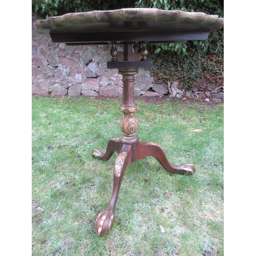 23 - A 19th century design tripod table having pie crust top over bird cage action and having gilt decora... 