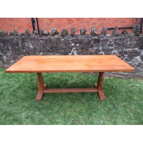 26 - A Robert Thompson Mouseman rectangular top dining table, raised on two octagonal legs on sledge feet... 