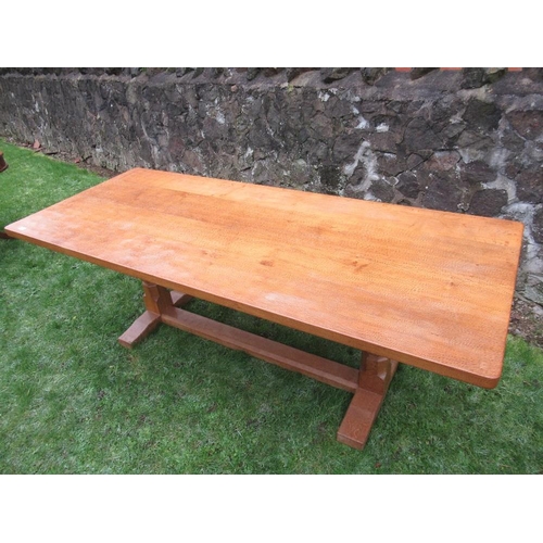 26 - A Robert Thompson Mouseman rectangular top dining table, raised on two octagonal legs on sledge feet... 