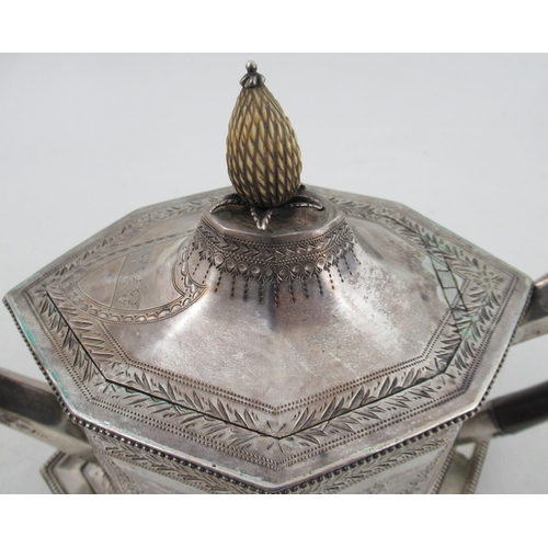 269 - A Georgian silver tea pot and stand, of octagonal form, with engraved floral swags and leaf border, ... 