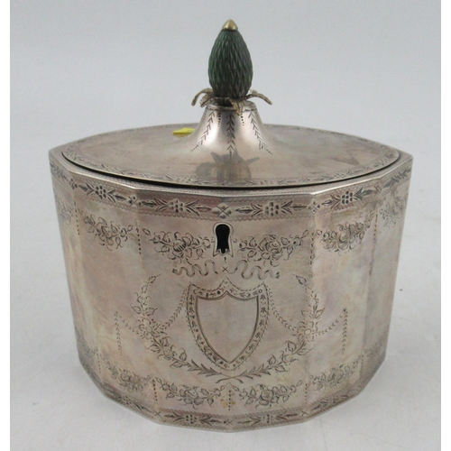 271 - A Georgian silver tea caddy, of octagonal form, with engraved floral swags and leaf border, with pin... 