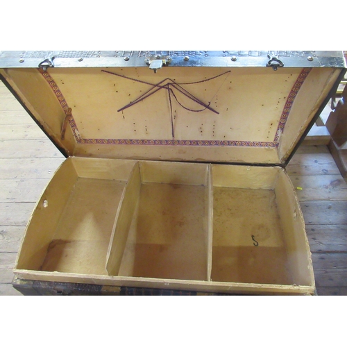 33 - A dome top trunk, having wooden bands and leather effect finish, width 32ins, height 24ins