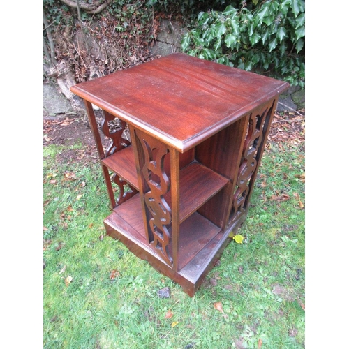 34 - A mahogany revolving book stand 16ins x 16ins