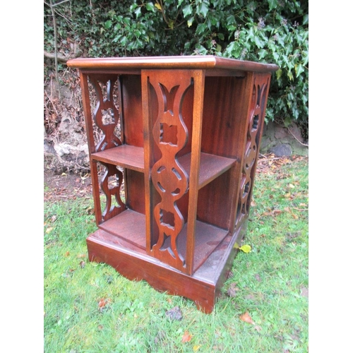 34 - A mahogany revolving book stand 16ins x 16ins