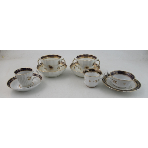 354 - A pair of Caughley chocolate cups and saucers, together with a trio and a cup and saucer