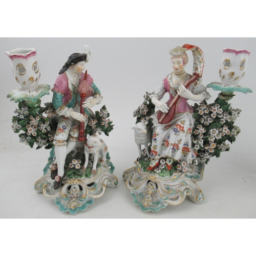 355 - A pair of 18th century Derby style figures, with sheep, and companion figure with floral candle stan... 