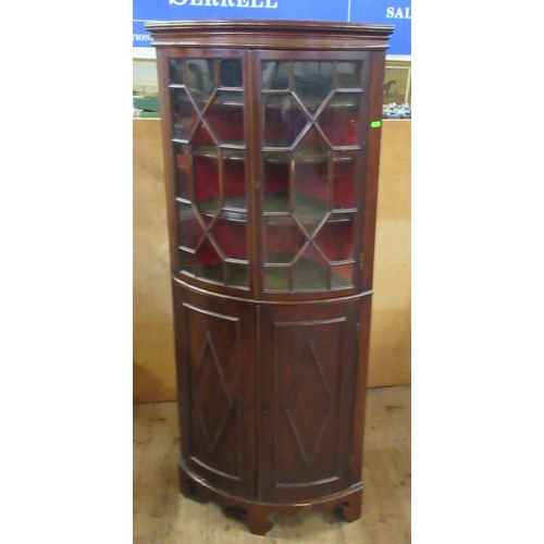 37 - A mahogany floor standing barrel fronted corner cabinet, with astragal glazed upper section and a pa... 