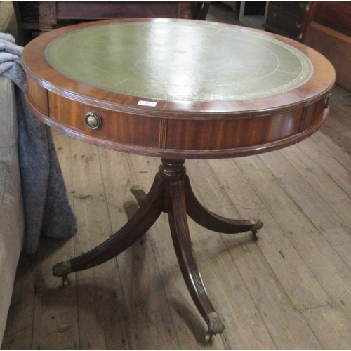 47 - A reproduction drum table, with leather inset top, diameter 36ins, height 31ins