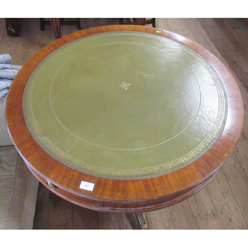 47 - A reproduction drum table, with leather inset top, diameter 36ins, height 31ins