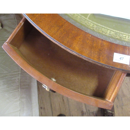 47 - A reproduction drum table, with leather inset top, diameter 36ins, height 31ins