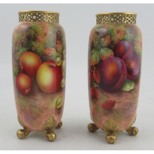 486 - A pair of Royal Worcester cylindrical shaped vases, painted half round with fruit by Townsend, with ... 