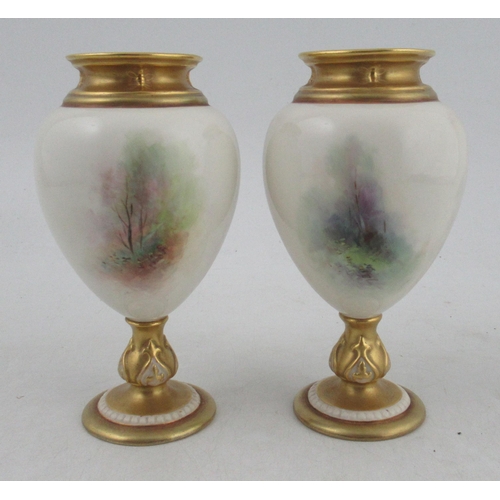 494 - A pair of Royal Worcester pedestal vases, decorated with sheep in a spring woodland with bluebells a... 