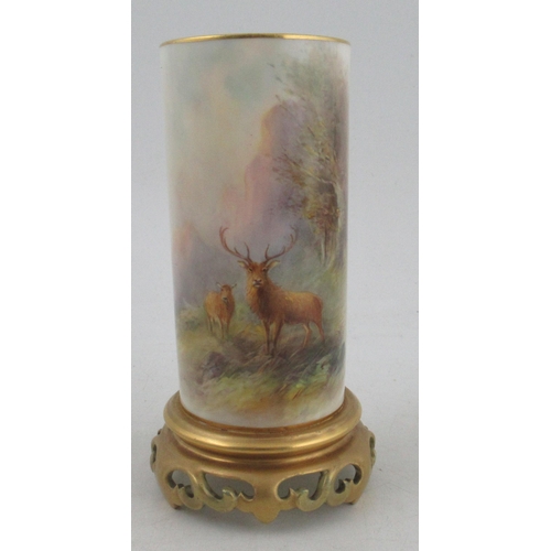 495 - A Royal Worcester cylindrical shaped vase, finely painted with a stag and a hind in a wooded landsca... 