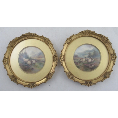 496 - A pair of Royal Worcester circular framed plaques, finely painted with sheep in a landscape with spr... 