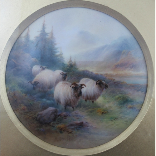 496 - A pair of Royal Worcester circular framed plaques, finely painted with sheep in a landscape with spr... 