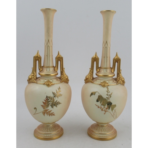 504 - A pair of Royal Worcester ivory vases, decorated with finely gilded ferns, minor chip to one handle ... 