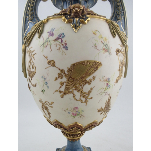 507 - A Royal Worcester Hadleys style pedestal vase, decorated with coloured flowers, gilded fans, harps a... 