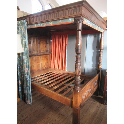 54 - An antique oak four post bed