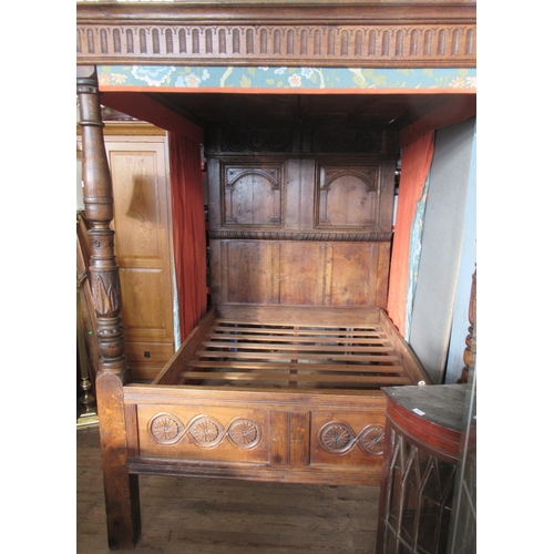 54 - An antique oak four post bed