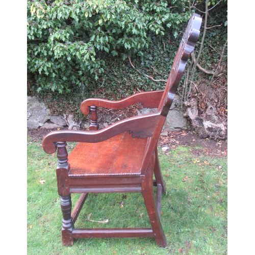 55 - An antique Oak Wainscot chair, the head rest having carved decoration and stamped Iohn Sandrs 1660