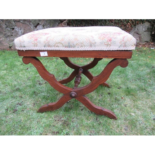 6 - An upholstered stool raised on x frame stretchers 23ins x 16ins, height 20ins