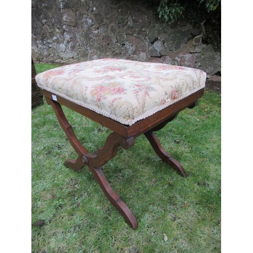 6 - An upholstered stool raised on x frame stretchers 23ins x 16ins, height 20ins