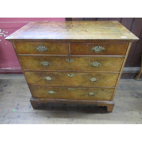 7 - An 18th walnut chest of drawers with cross banded decoration raised on bracket feet, width 39ins, he... 