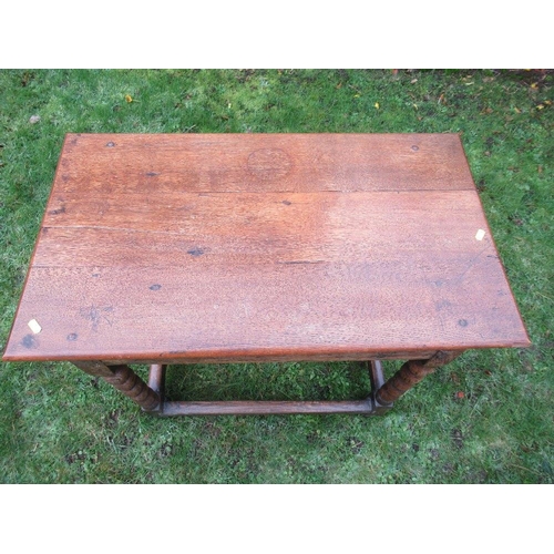 70 - An Antique oak side table, raised on bobbin turned legs united by stretchers