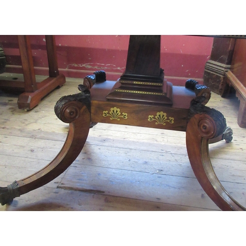 8 - A Regency rosewood sofa table, with brass stringing, fitted with two frieze drawers, with central br... 