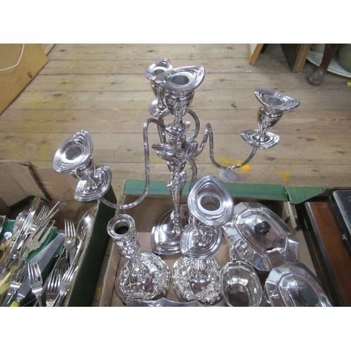 221A - Three boxes of assorted silver plate to include four branch candelabra , tea set , jersey jug, flatw... 